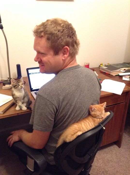 Look at who's helping me do my homework - two adorable kittens.
